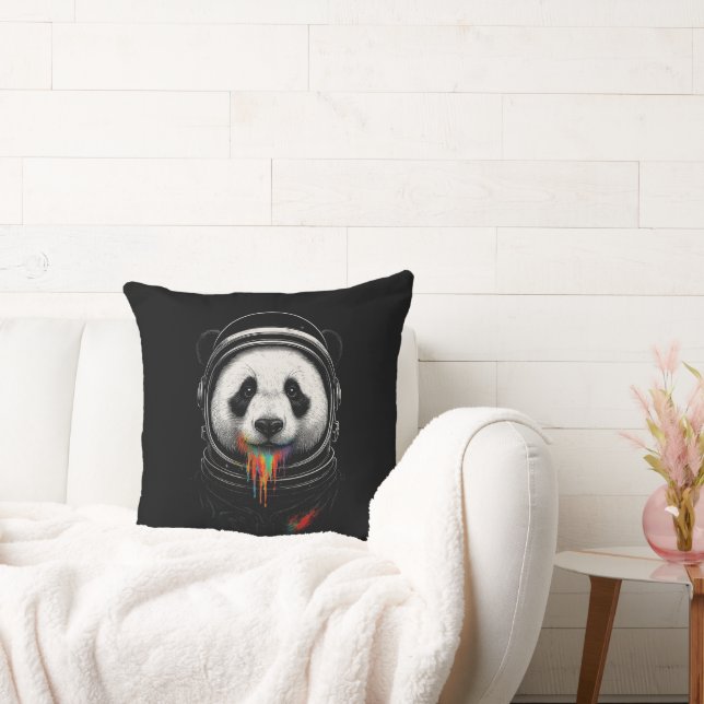 A black and white panda bear wearing a space suit cushion (Couch)