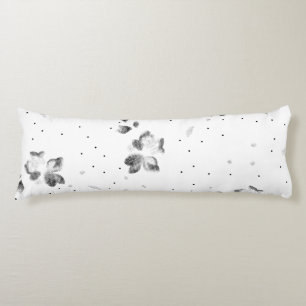 a black and white photo of a bunch of dots body cushion
