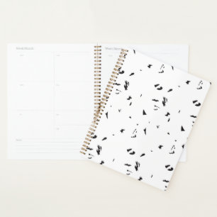 a black and white photo of a flock of birds planner