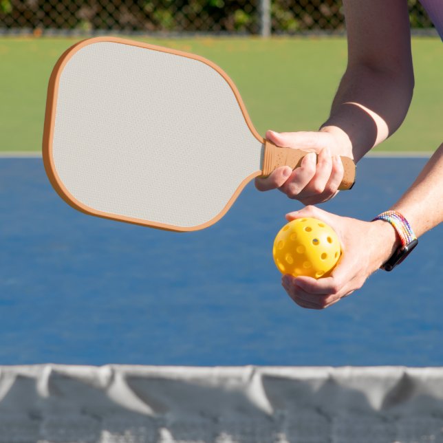 a black and white photo of a man in a suit and tie pickleball paddle (Insitu)