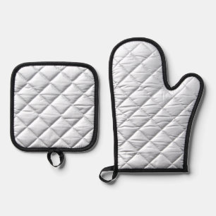 a black and white photo of a person holding a cell oven mitt & pot holder set