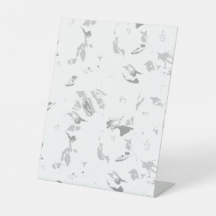 a black and white photo of a white background pedestal sign