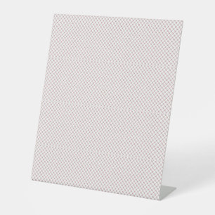 a black and white photo of a white background pedestal sign