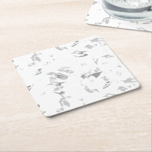 a black and white photo of a white background square paper coaster