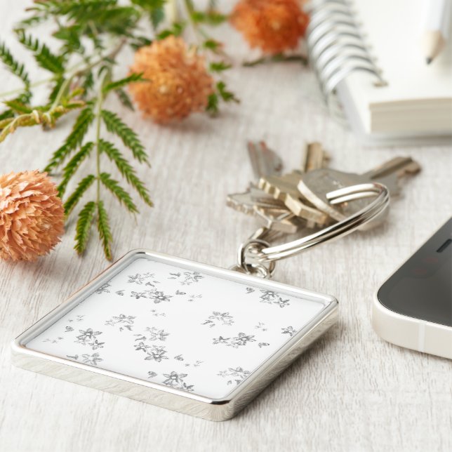 a black and white photo of snow flakes key ring (Side)