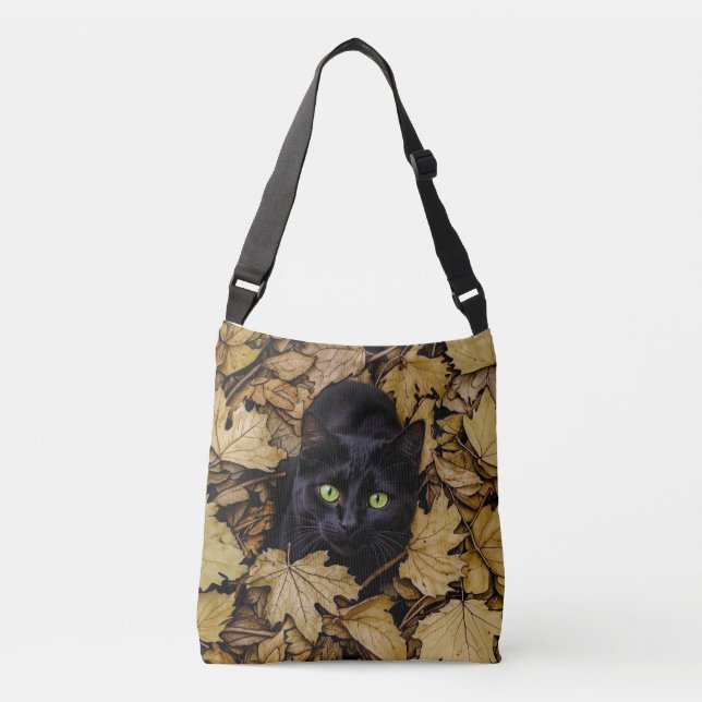 A black cat is playing in the autumn leaves crossbody bag (Front)