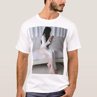 A Black-Haired Woman Wearing a Blue Pheasant Drink T-Shirt