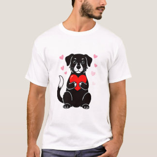 A black puppy holding a red heart T-Shirt