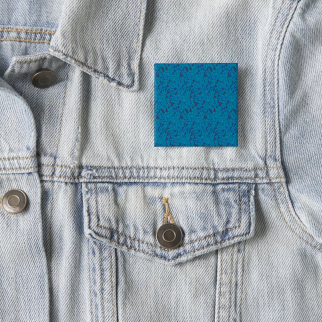 a blue and black background with a pattern 15 cm square badge (In Situ)