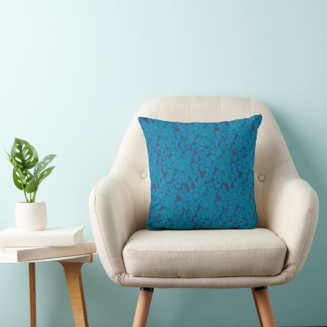 a blue and black background with a pattern cushion (Chair)