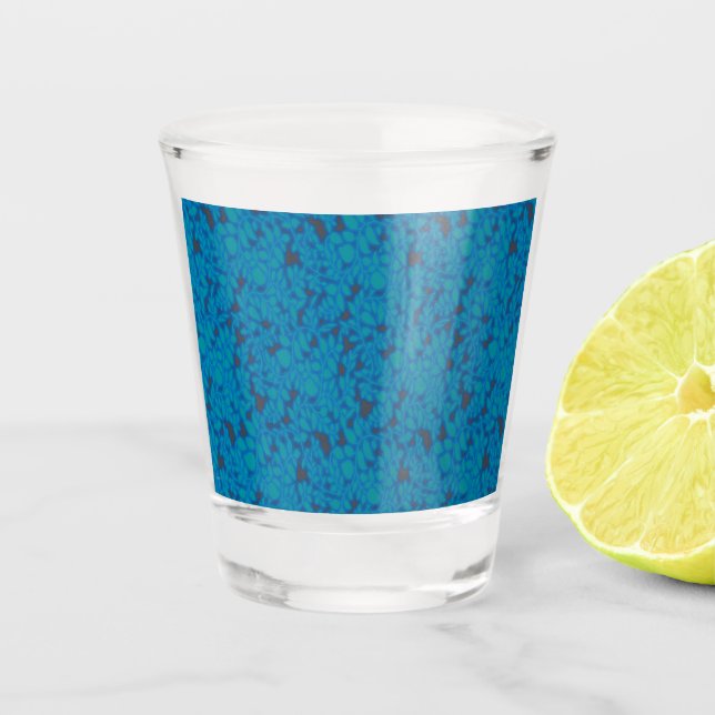 a blue and black background with a pattern shot glass (Front)