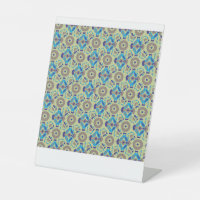 a blue and green pattern on a green background