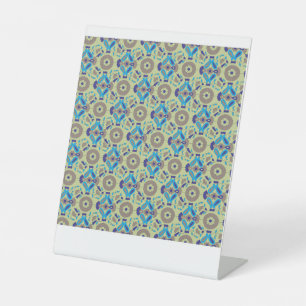 a blue and green pattern on a green background pedestal sign