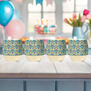 a blue and green pattern on a green background stemless wine glass