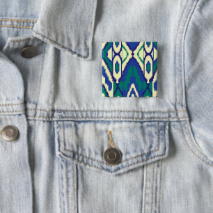 a blue and green pattern with a white background 15 cm square badge
