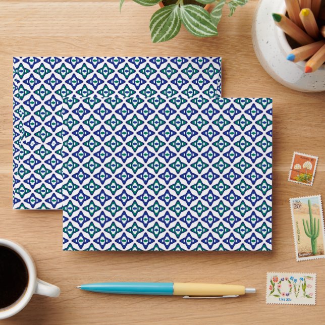 a blue and green pattern with a white background envelope (Desk)