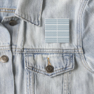 a blue and white pattern with a white background 15 cm square badge