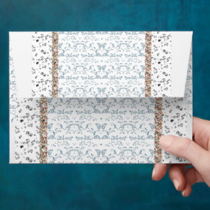 a blue and white wallpaper with a pattern on it envelope