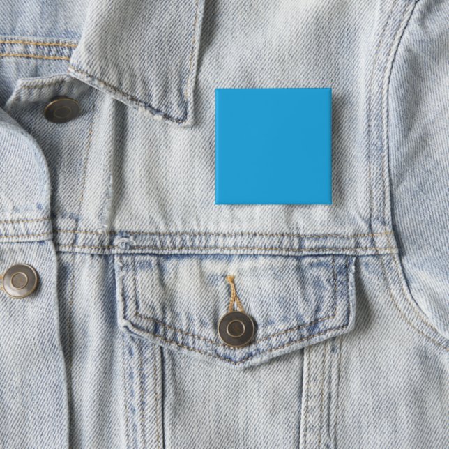 a blue background with a black and white cat 15 cm square badge (In Situ)