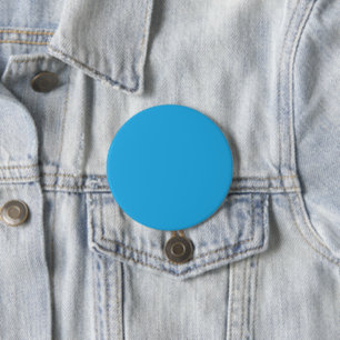 a blue background with a black and white cat 7.5 cm round badge