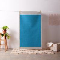 a blue background with a black and white cat on to
