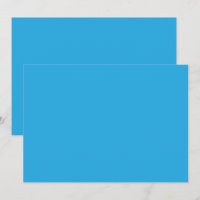 a blue background with a black and white cat on to
