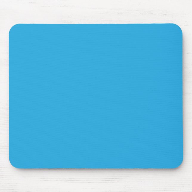 a blue background with a black and white cat on to mouse mat (Front)