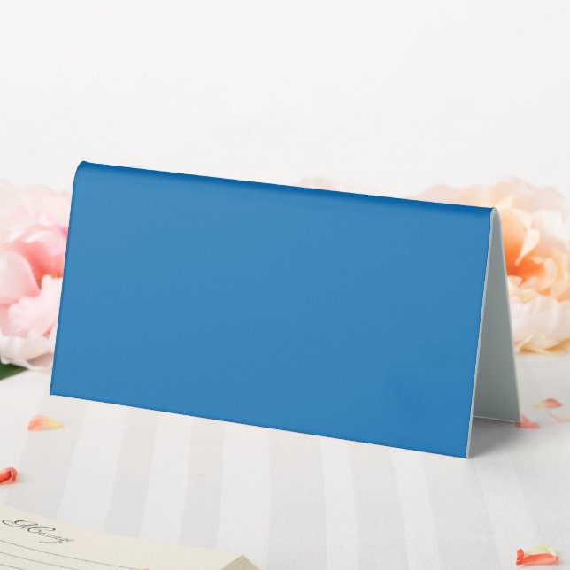 a blue background with a black and white clock (In SItu (Wedding))