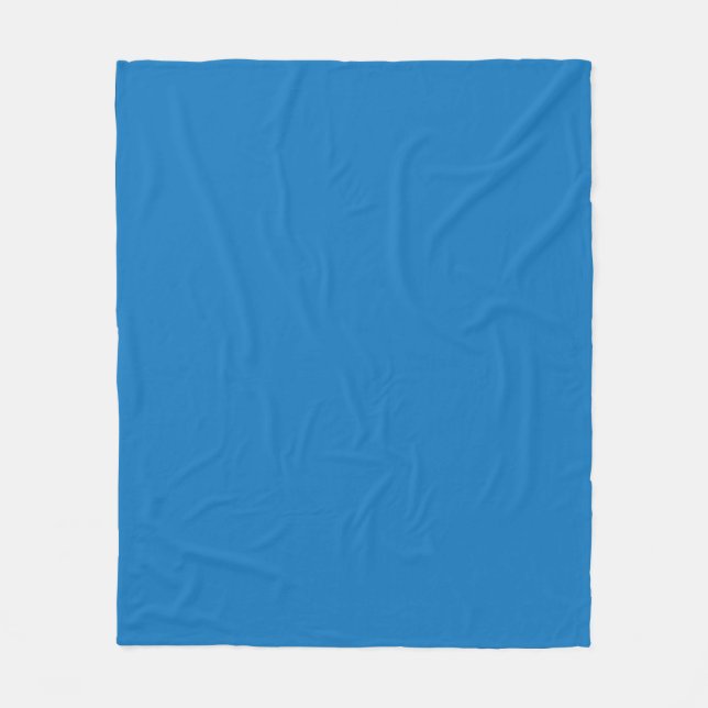 a blue background with a black and white clock fleece blanket (Front)
