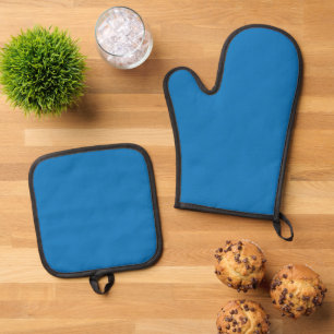 a blue background with a black and white clock oven mitt & pot holder set