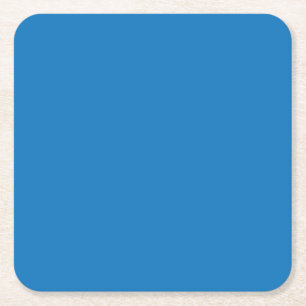 a blue background with a black and white clock square paper coaster