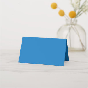 a blue background with a place card