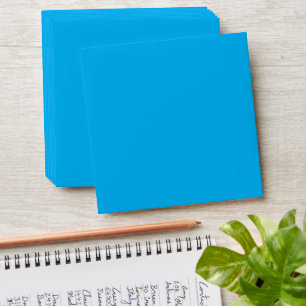 a blue sky with a plane flying in the sky envelope