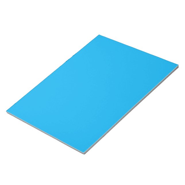 a blue sky with a plane flying in the sky notepad (Angled)