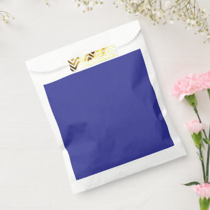 a blue wall with a clock favour bags