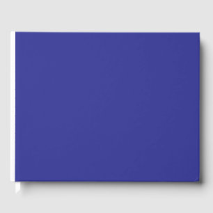 a blue wall with a clock guest book