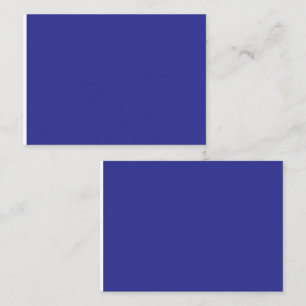 a blue wall with a clock place card