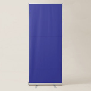 a blue wall with a clock  retractable banner