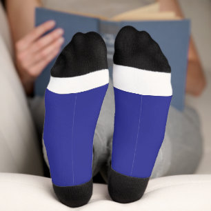 a blue wall with a clock  socks