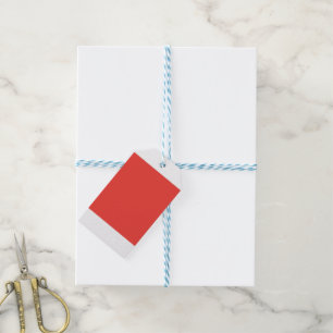A bold red square surrounded by a crisp white bord gift tags