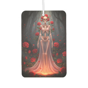 A bony girl wears a wedding dress in a forest. car air freshener