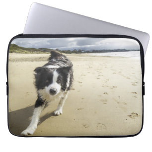 A Border Collie Dog Running On The Beach Laptop Sleeve