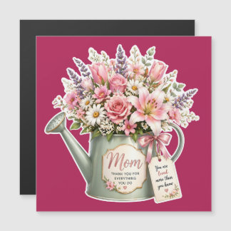 A bouquet of flowers in a watering can for mum