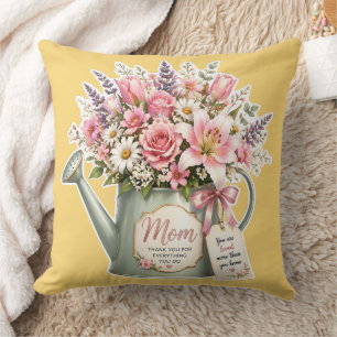 A bouquet of flowers in a watering can for mum cushion