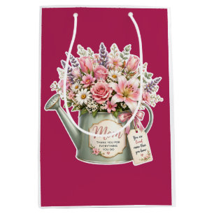 A bouquet of flowers in a watering can for mum  medium gift bag
