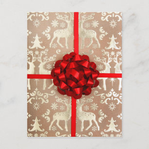 A bow and ribbon on Christmas wrapping paper Holiday Postcard