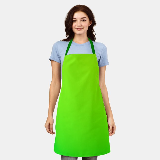 A bright green apron with neck and waist straps  (Worn)