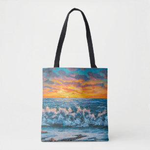 A bright sunset during a storm. An oil painting on Tote Bag