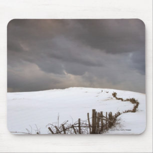 A Broken Fence Along A Snow Covered Field Mouse Mat