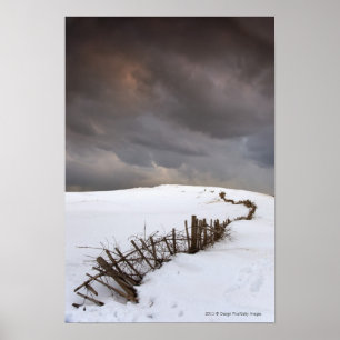 A Broken Fence Along A Snow Covered Field Poster